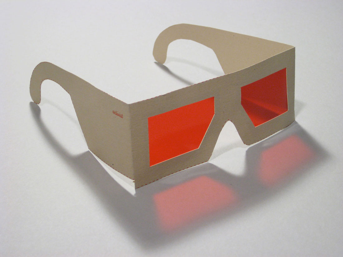 SeeingRed (glasses cut out by viewers), 2008, screenprint,
          rubylith, 6 x 3 x 6 inches / 152 x 76 x 156 mm
