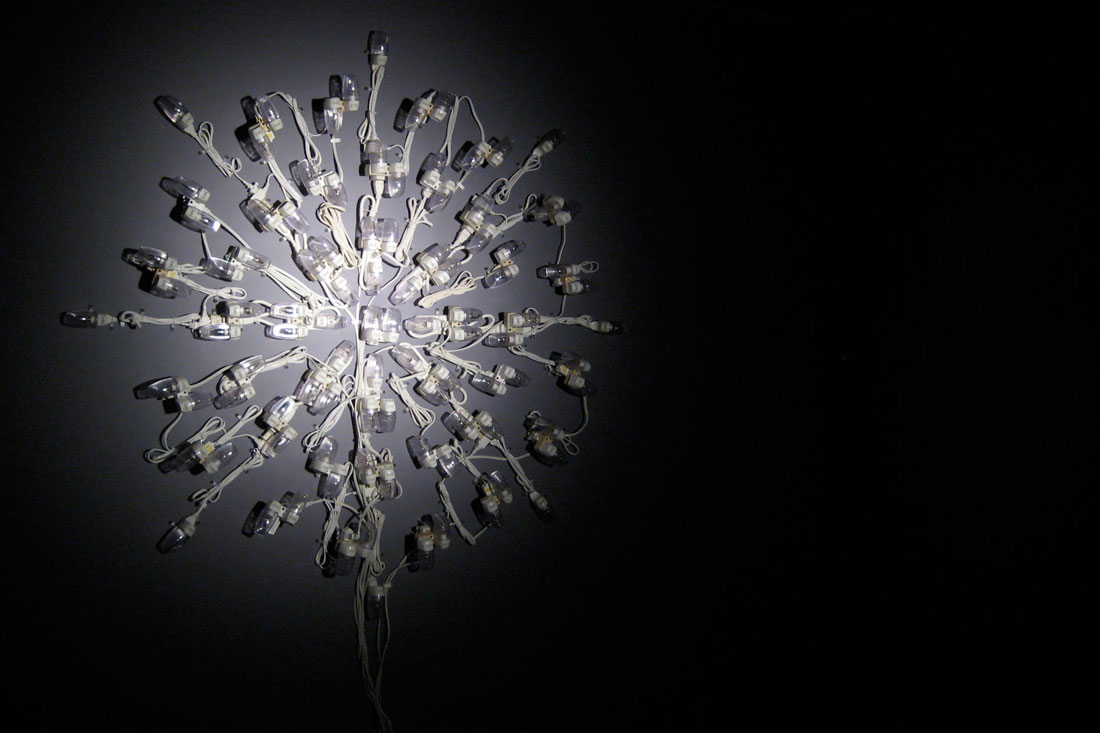 Dark into Light, 2008, mixed media installation: 100 night lights, par can, spot bulb, 10 x 10 x 8 feet / 3 x 3 x 2.4 m