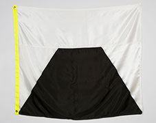 white flag that shows a black pyramid with the top cut off. 