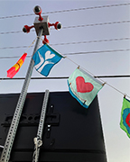Lillian and Alexis' heart flags hanging during installation.