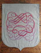 a neutral-colored banner with a slight grey weave, the bottom is sewn in an onion shape. it is over printed with a balloon-shaped calligraphic flourish, in light pink and pink. the designs are rotated 180 degrees and offset to make a taller shape