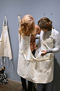 Visitors wearing the double apron