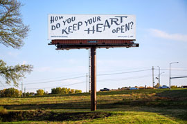 photo of a billboard with calligraphy drawn in graphite pencil with the question, How do you keep your heart open?
