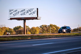 Billboard with calligraphy drawn in graphite pencil with the question, How do you keep your heart open?