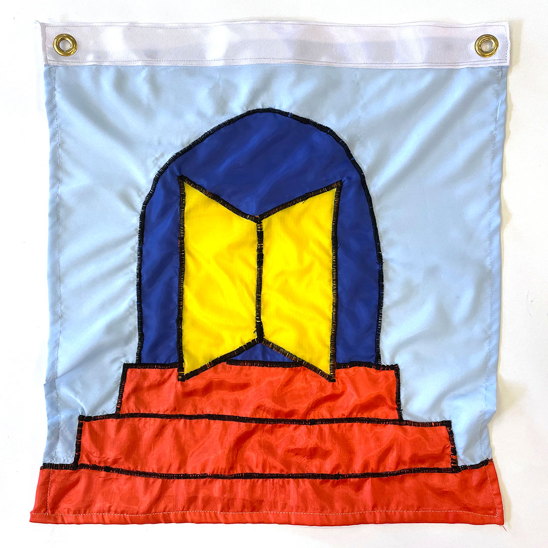 a sewn flag of an open book with yellow pages atop 3 orange steps in a royal blue doorway on a light blue background. 