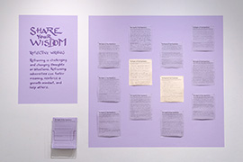 activity area painted in lavendar with instructions for a reframing writing exercise, a display area with samples of completed writing, and handouts