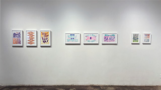 installation view of the 8 Life Lessons prints, framed in white frames on a white wall