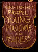 Quote that reads, A place of belonging to propel young musicians to be fearless.