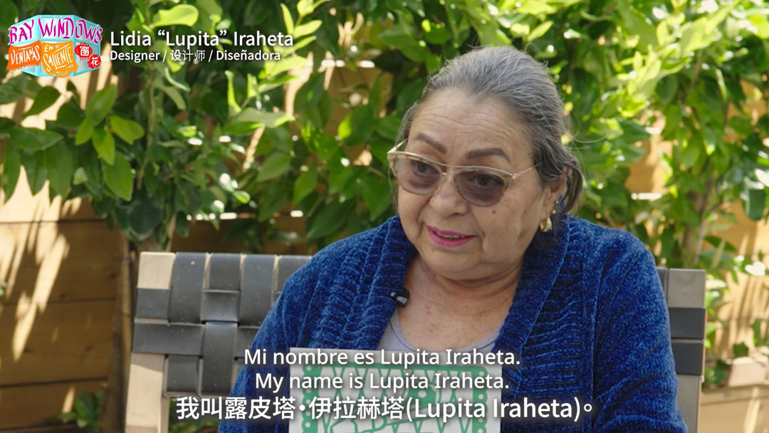 still of trilingually subtitled video interview with a woman, available at the link