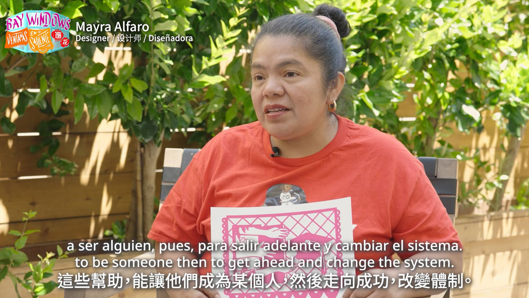 still of trilingually subtitled video interview with a woman, available at the link