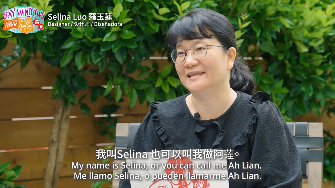 still of trilingually subtitled video interview with a woman, available at the link